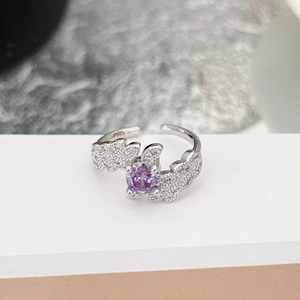 Detailed close-up of a purple zircon ring featuring a silver-colored adjustable open band