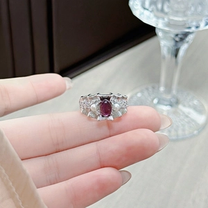 Macro view of vintage silver ring with purple oval gemstone and pearl details