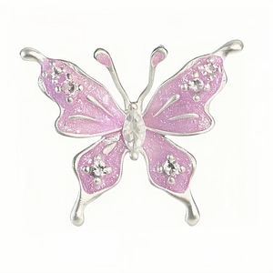 Sparkling butterfly open ring with pink enamel and zircons on white background