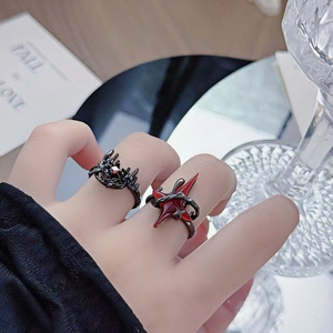 Gothic punk style black thorn rings set with red stones for Halloween dark aesthetic
