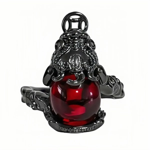 Dark punk Halloween ring with black metal dragon relief and a large red crystal bead