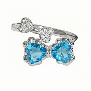 Minimalist silver bow open ring with blue heart crystals and sparkling white zircons