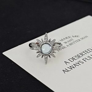 Detailed macro view of the celestial starburst ring with a blue moonstone center