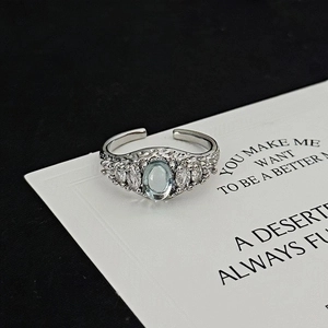 Detail of adjustable silver ring with blue moonstone and marquise zircon accents