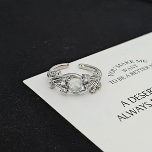 Detailed close-up of a silver adjustable ring featuring moonstone and zircon stones