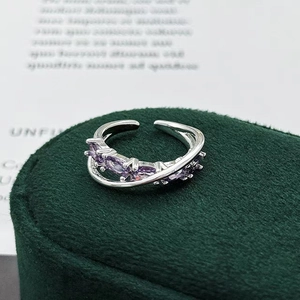 Macro view of double-layered silver ring with marquise-cut purple zircon stones