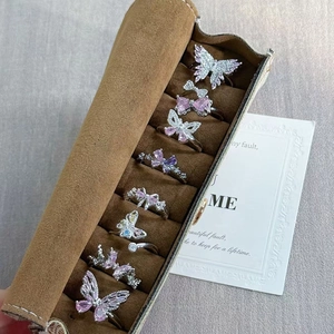 Luxury butterfly and bow zircon ring set with pink and purple stones in jewelry box