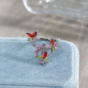 Macro shot of silver butterfly ring with colorful marquise zircons in a jewelry box