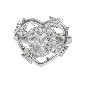 French luxury heart-shaped silver ring with diamonds and thorn frame on white background
