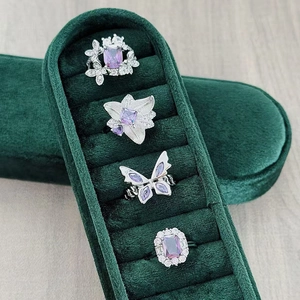 Detail shot of four-piece purple zircon ring set with butterfly and floral designs