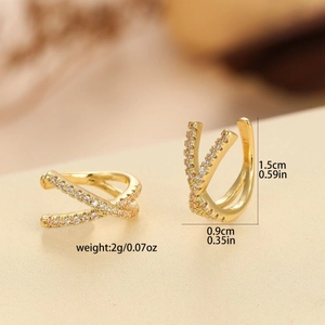 Gold criss-cross ear cuffs with cubic zirconia inlay, measuring 1.5cm by 0.9cm