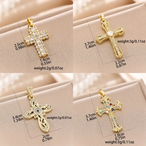 Detail view of colorful zircon cross pendants with intricate engravings and dimensions