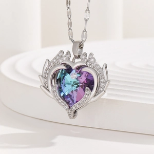 Elegant Heart of the Ocean angel wing necklace with blue crystal pendant for women