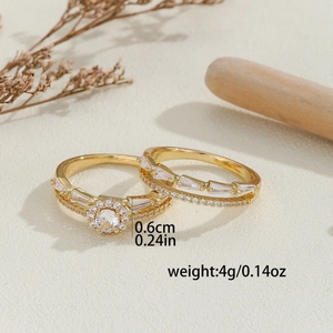 Luxury gold rings set with micro-paved zircons on minimalist textured background