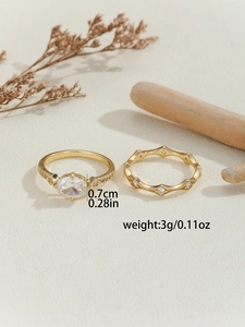 Macro shot of gold-plated rhombus zircon ring set with dimensions and weight specs