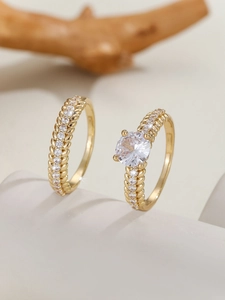 Detailed view of gold wheat ear rings set featuring a round zircon engagement ring
