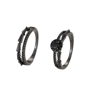 Elegant black zircon studded couple rings set with gun-black finish on white background