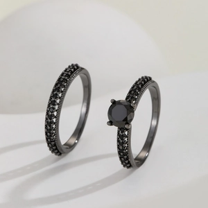 Minimalist black plated copper ring set with micro-pave black zircon and round center stone