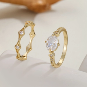 Luxury gold plated two-piece ring set with oval cut cubic zirconia and micro pave band