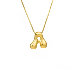 Detailed close-up of 3D puffy letter A pendant with a delicate gold-toned box chain