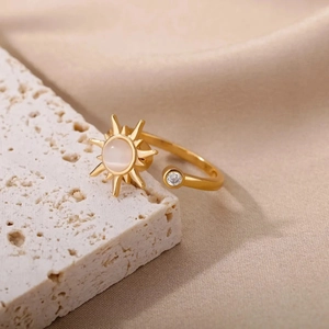 Rotating golden sunflower open ring with central moonstone and dainty crystal accent