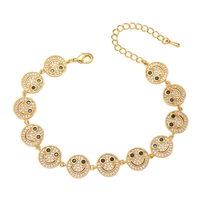 Detail of gold-plated smiley face bracelet featuring sparkling zircon pave settings