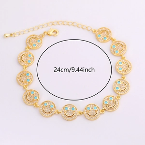 Adjustable 24cm gold bracelet with zircon smiley face charms and blue stone eyes