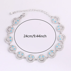 Silver smiley face bracelet with sparkling zircons and blue eye details, 24cm length