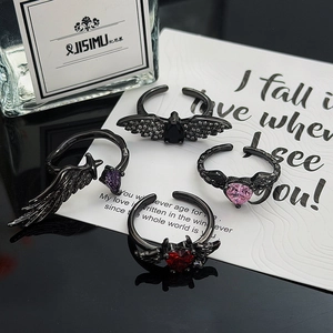 Gothic black metal ring set with colorful heart zircons and dark bat wing designs