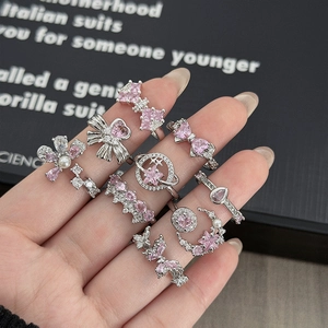 Set di 10 anelli in argento con pietre rosa e motivi a farfalla stella e corona