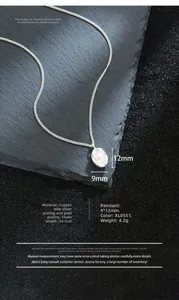 Macro detail of oval pearl pendant with wavy silver base and 45.5cm chain link