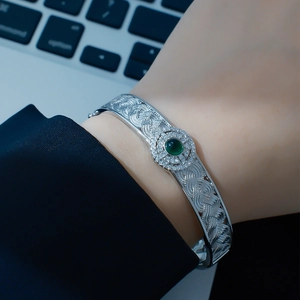 Silver woven lace bangle with green jade gemstone and diamonds in vintage style