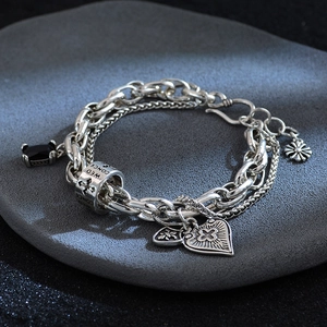 Vintage multi-layer cross bracelet with black zircon pendants and retro fleur-de-lis charms
