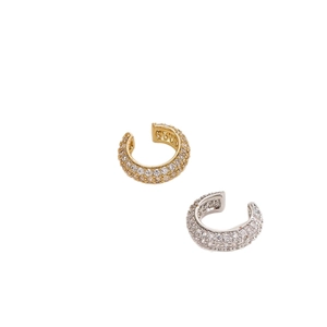 Modern gold and silver pavé ear cuffs featuring multiple rows of cubic zirconia stones