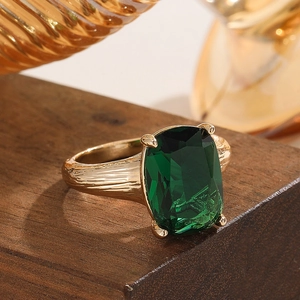 Vintage golden ring with rectangle emerald green zircon and textured bark finish