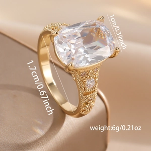 Macro detail of vintage gold copper ring with rectangle zircon and granulation craft