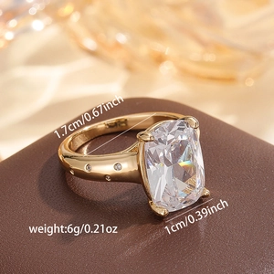 Detail view of gold ring with square cubic zirconia stone showing 1.7cm inner diameter