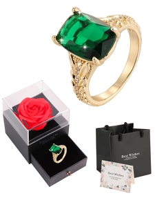 Elegant emerald cut green gemstone ring with luxury rose gift box and matching bag