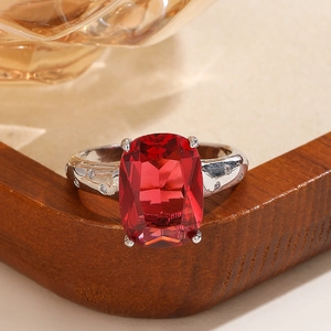 Macro view of a classic square cut red zircon stone with silver four-prong setting