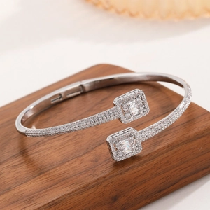 Silver copper zircon open bracelet featuring dual square heads with sparkling emerald cut stones
