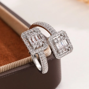 Sparkling silver open ring with square clusters of baguette and pavé set cubic zirconia