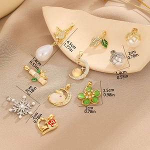 Collection of Chinoiserie style pearl pendants with butterfly and floral designs