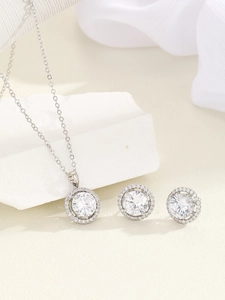 Detailed view of silver halo jewelry set featuring round zircon necklace and earrings