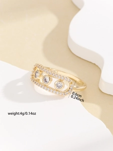 Detailed close-up showing dimensions of the gold rectangle ring with floating clear stones