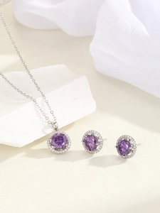 Detailed view of luxury purple zircon halo necklace and matching stud earrings set