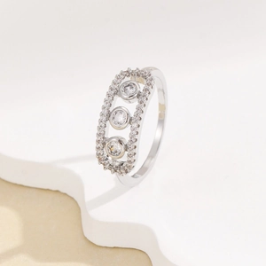 Elegant silver ring with moving triple diamonds in a rectangular pave frame