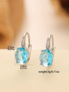 Detail showing dimensions of oval blue gemstone hoop earrings with sparkling cubic zirconia