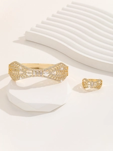 Detailed view of hollow bow-shaped jewelry set with micro-pave cubic zirconia crystals