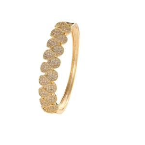 Elegant gold-plated hinged bangle featuring a micro-pave drop-shaped cutout pattern
