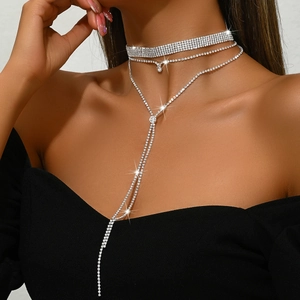 Layered silver rhinestone choker necklace with long tassels and sparkling crystal charms